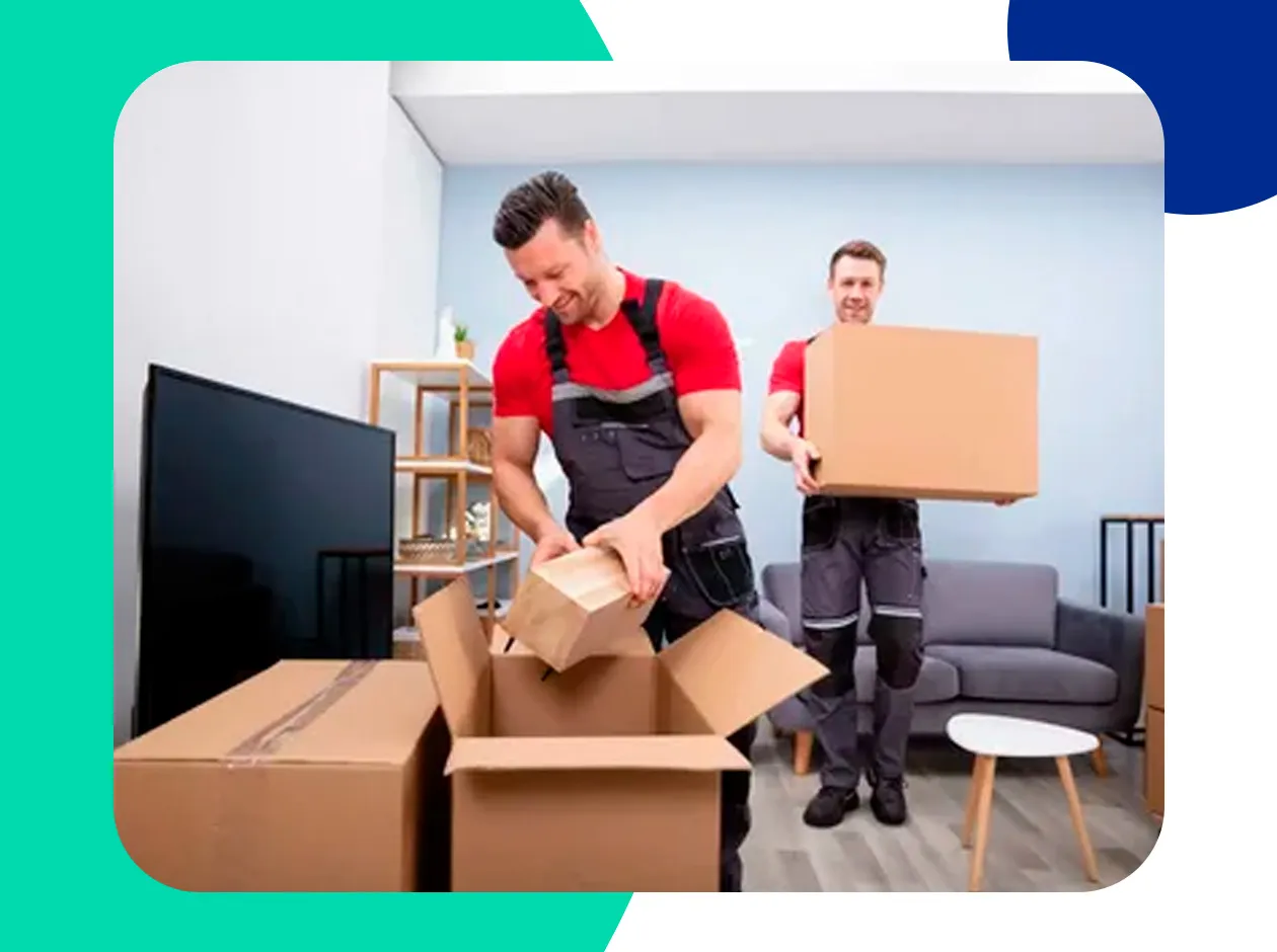 Movers loading furniture into a service lift in a Dubai Marina tower
